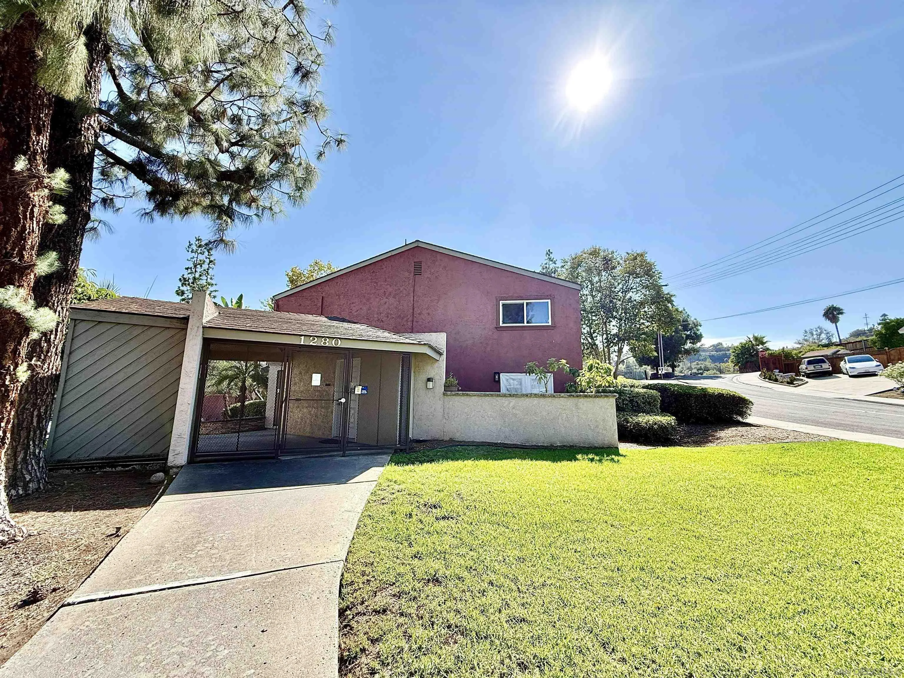 1280 West Main Street, Unit 3 El Cajon, CA 92020 - Photo 29 of 29 a front view of a house with yard and garage