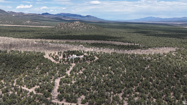 St, Unit 1 & 2 Modena, UT 84753 - Photo 31 of 69 Expansive property with a dwelling nestled within a wooded landscape, surrounded by natural terrain and distant mountains