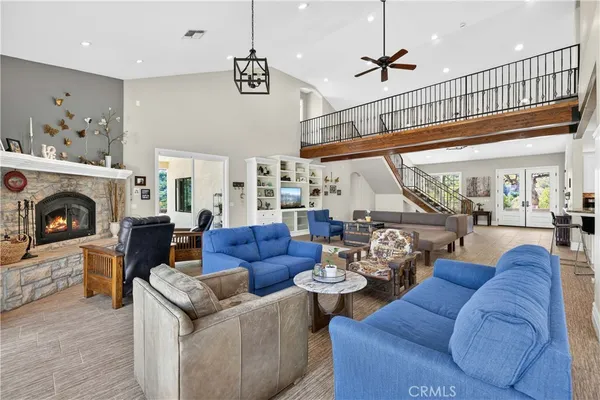 a living room with furniture fireplace and a flat screen tv