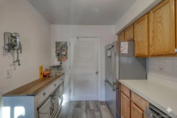 a kitchen with stainless steel appliances a refrigerator and a stove