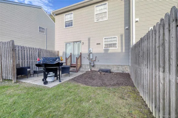 a view of a backyard with sitting area