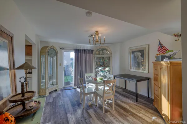 a view of a livingroom with furniture and a window