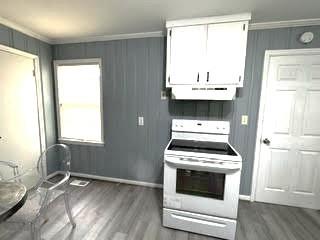 209 Moultrie Lane Southwest Rome, GA 30161 - Photo 25 of 46 a kitchen with a stove a sink and a window