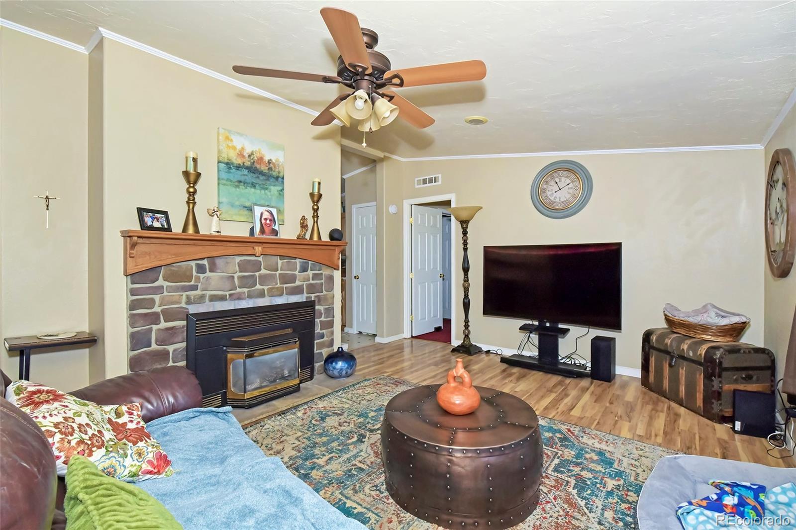 44 Southpark Road Florissant, CO 80816 - Photo 13 of 39 a living room with furniture and a fireplace