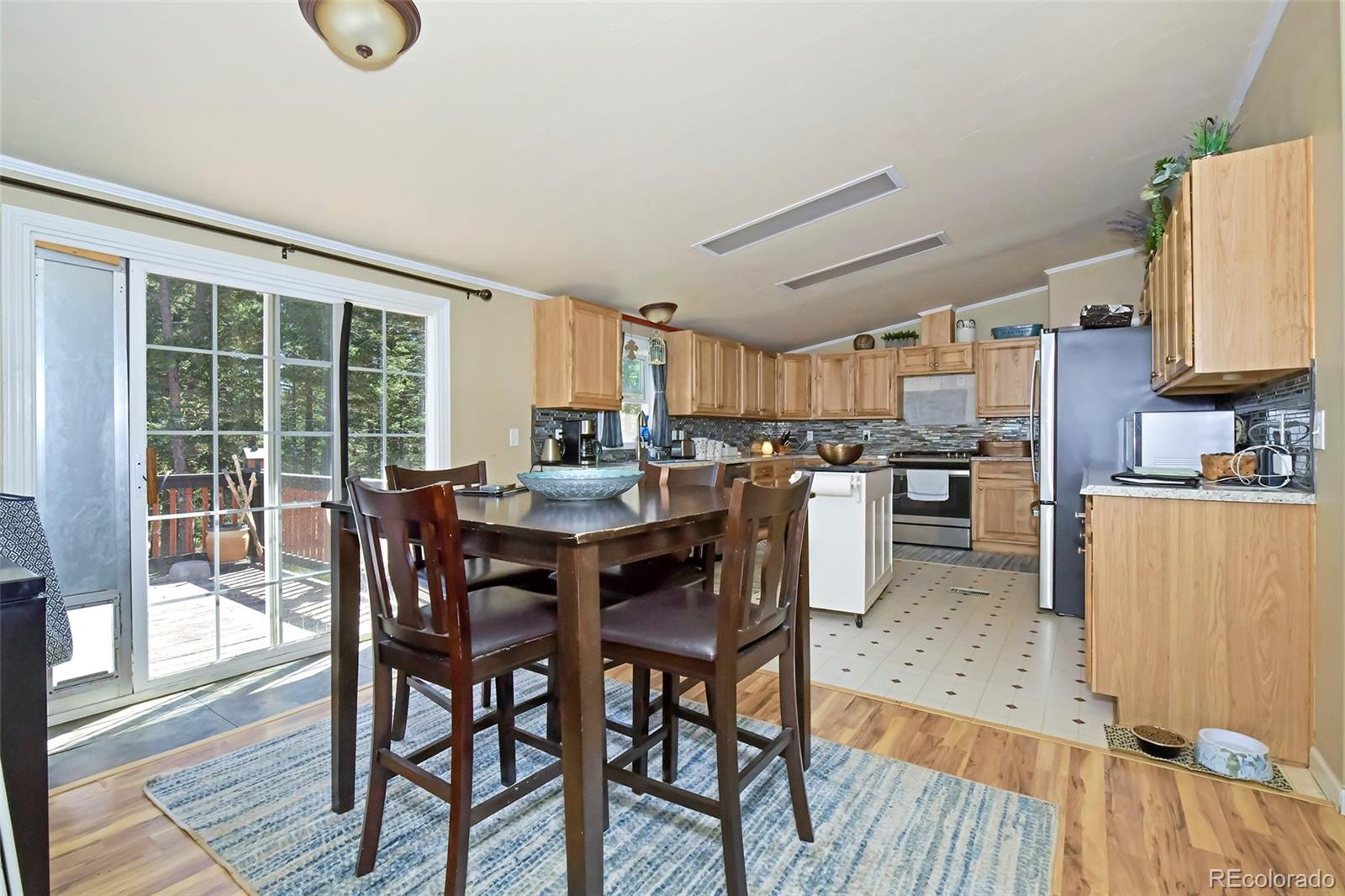 44 Southpark Road Florissant, CO 80816 - Photo 18 of 39 a view of a dining room with furniture window and wooden floor