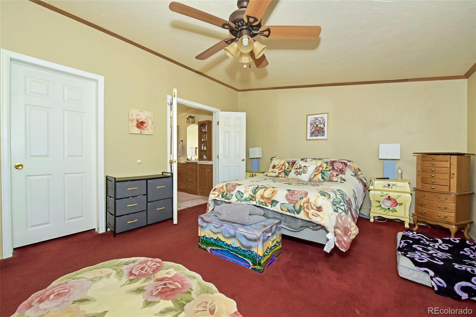 44 Southpark Road Florissant, CO 80816 - Photo 24 of 39 a bedroom with a bed dresser and a window