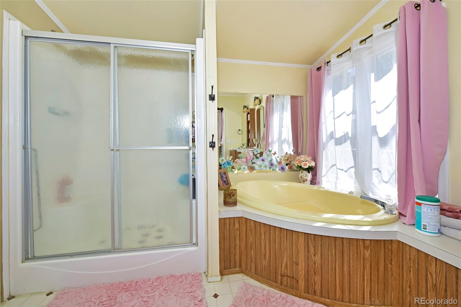 44 Southpark Road Florissant, CO 80816 - Photo 26 of 39 a bathroom with a tub and shower