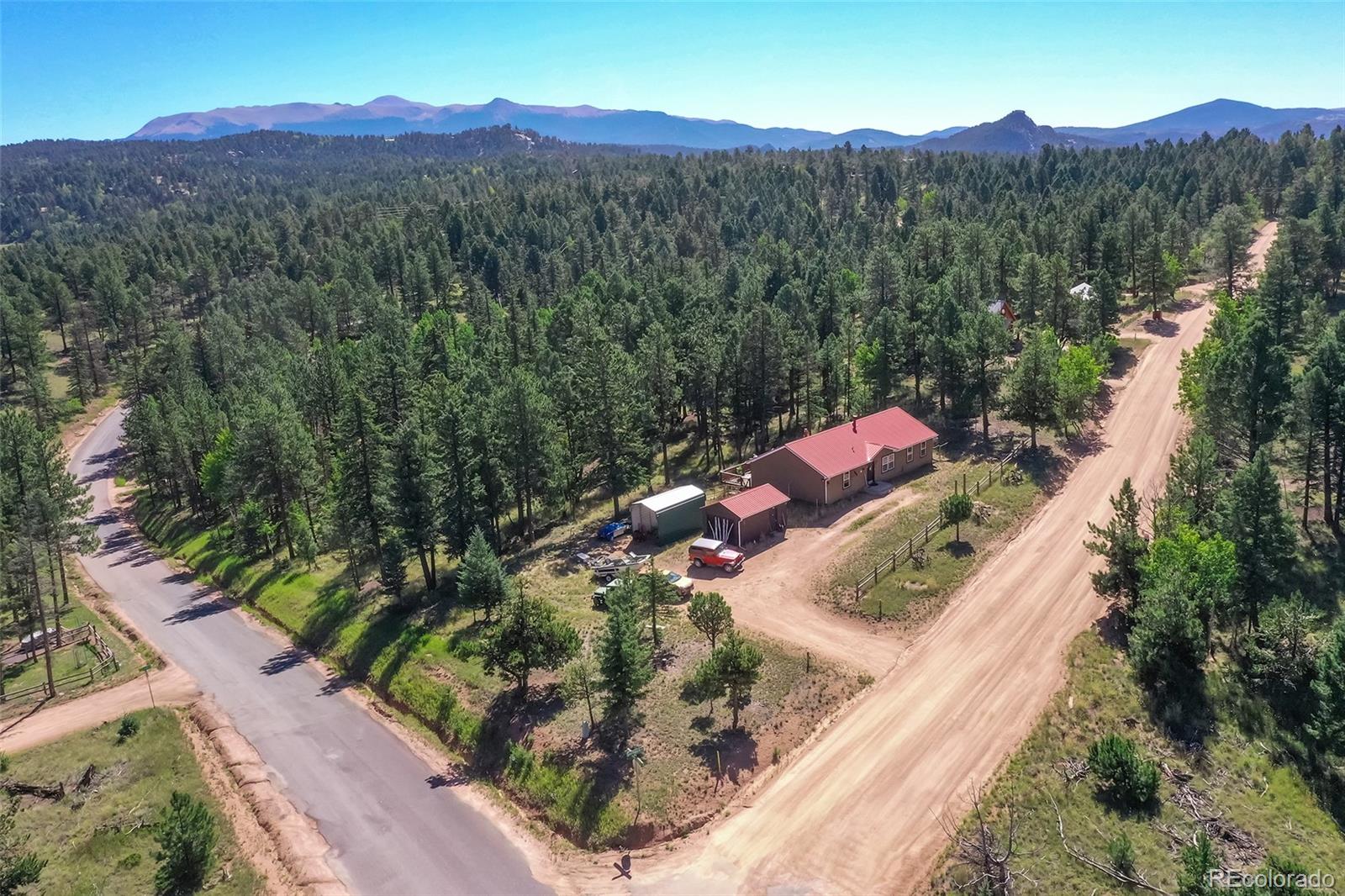 44 Southpark Road Florissant, CO 80816 - Photo 33 of 39 an aerial view of a house with a mountain