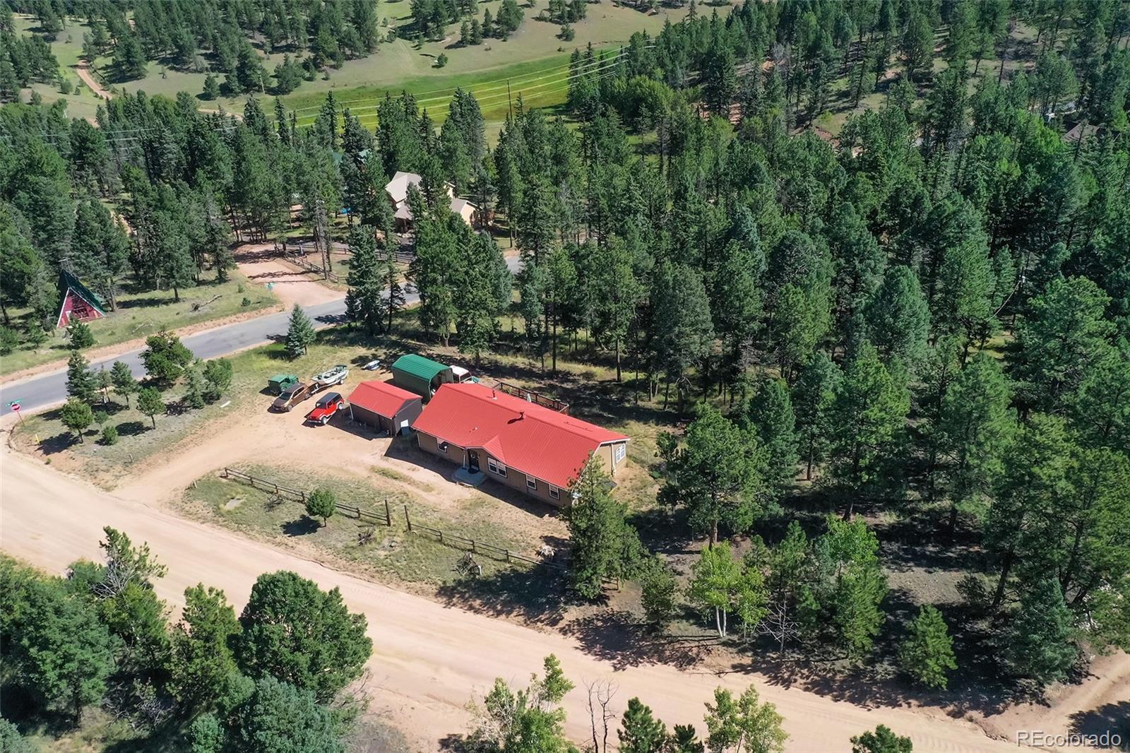 44 Southpark Road Florissant, CO 80816 - Photo 37 of 39 an aerial view of residential house with outdoor space and trees all around