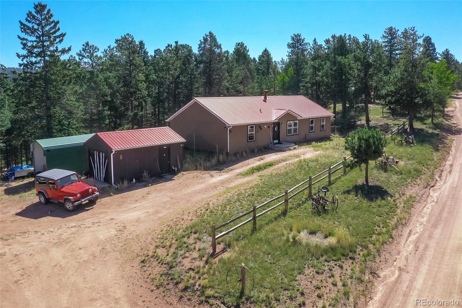 44 Southpark Road Florissant, CO 80816 - Photo 39 of 39 a view of a house with a yard and sitting area