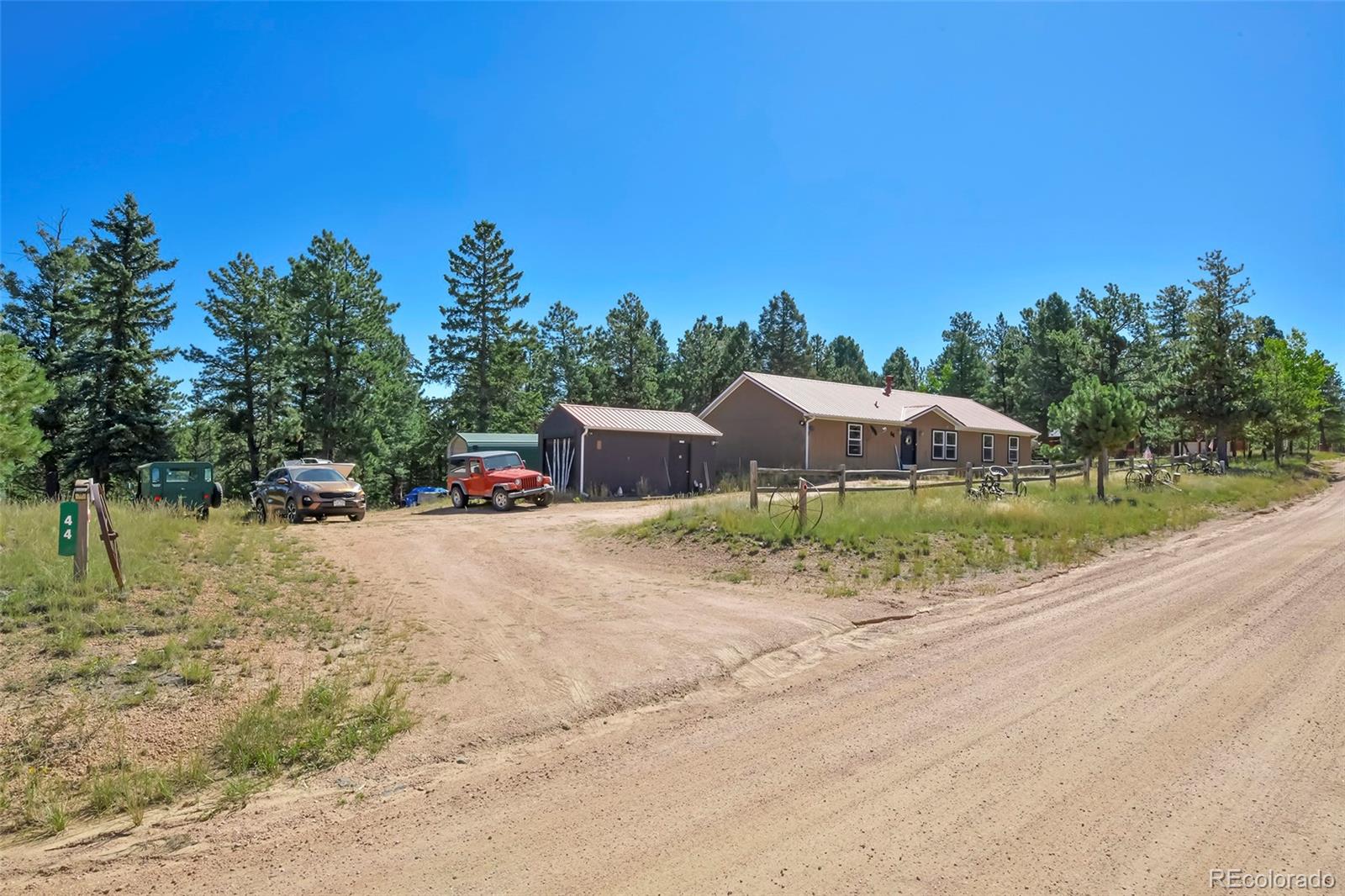 44 Southpark Road Florissant, CO 80816 - Photo 4 of 39 a view of a dry yard with wooden fence