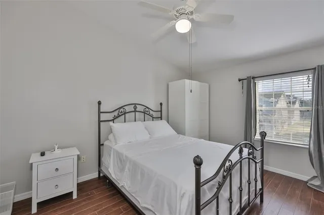 a bedroom with a bed and a dresser