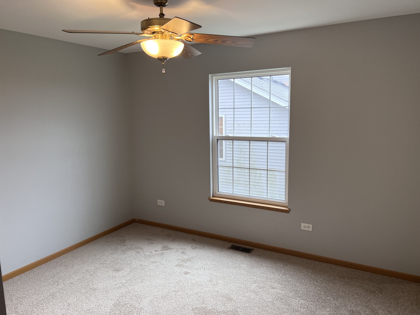 25838 Geranium Lane Monee, IL 60449 - Photo 17 of 21 an empty room with windows and fan