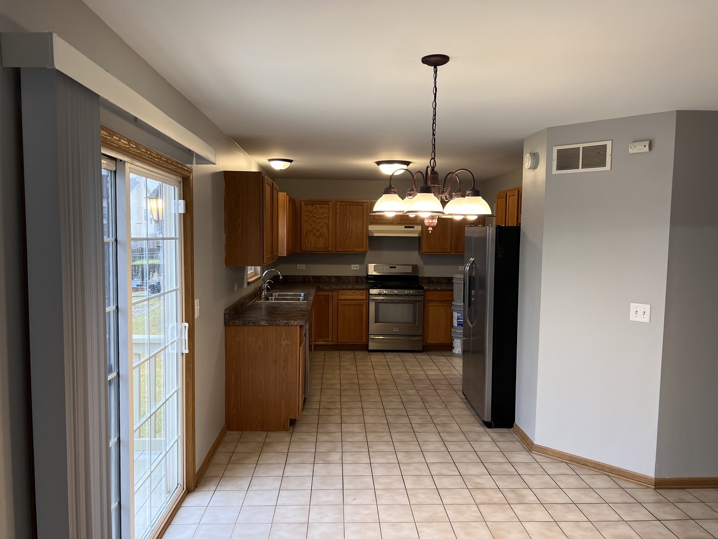 25838 Geranium Lane Monee, IL 60449 - Photo 5 of 21 a kitchen with a refrigerator and a sink