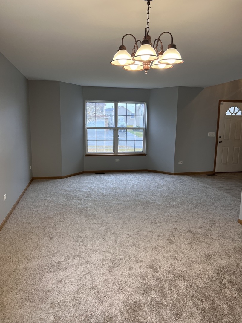 25838 Geranium Lane Monee, IL 60449 - Photo 8 of 21 a view of an empty room with a window