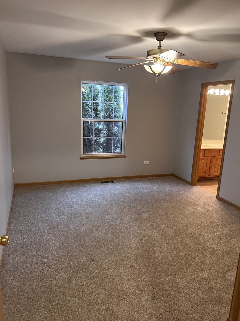 25838 Geranium Lane Monee, IL 60449 - Photo 10 of 21 an empty room with windows and fan