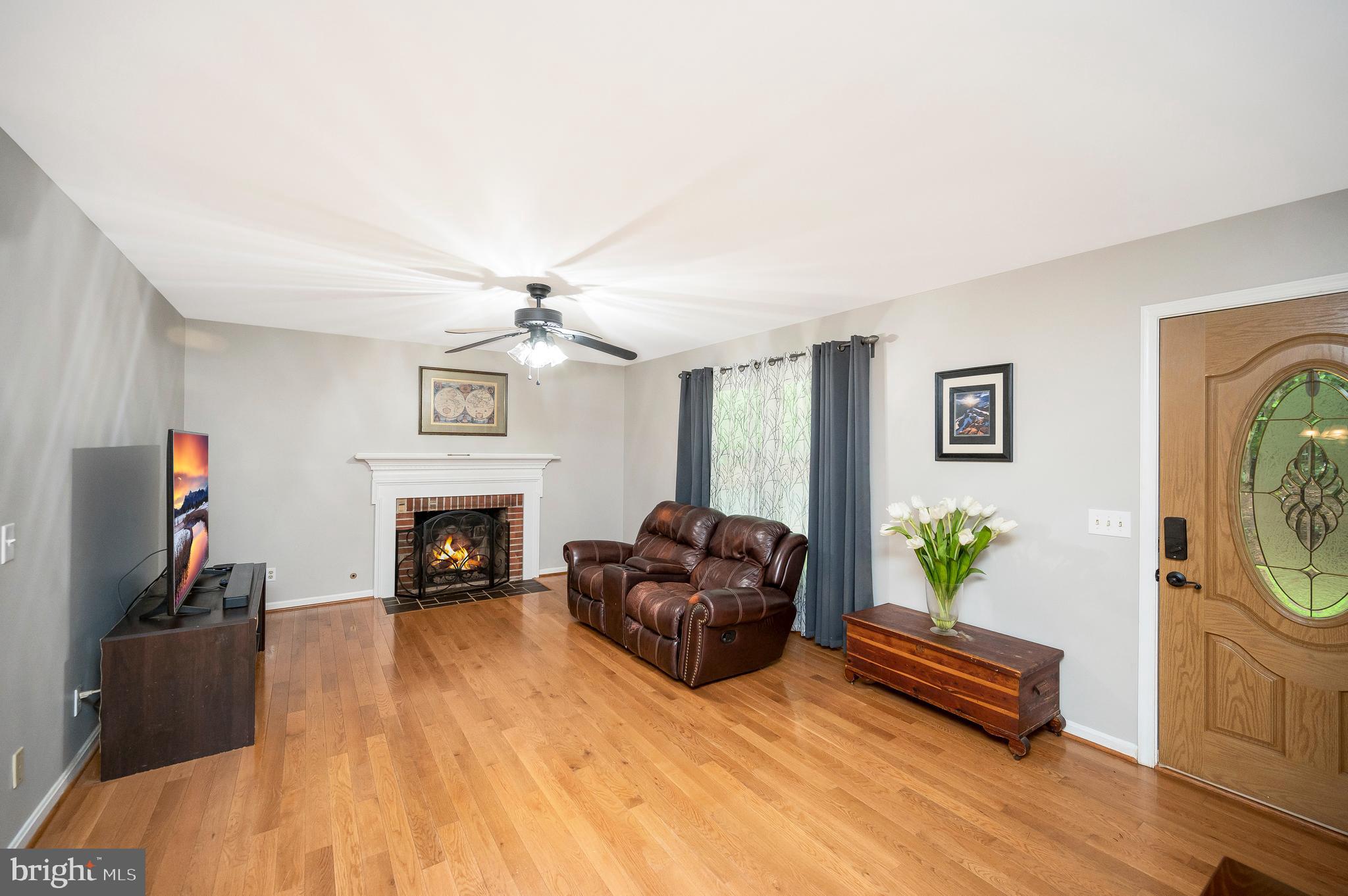 679 Cropp Road Fredericksburg, VA 22406 - Photo 10 of 39 a living room with furniture and a fireplace