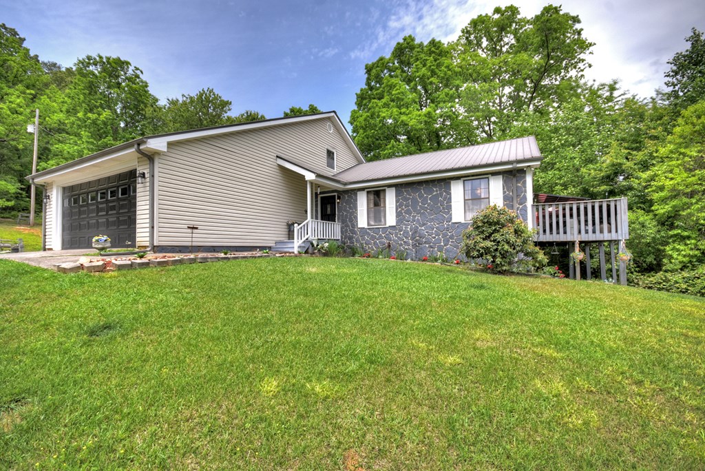 1359 Salem Road Mineral Bluff, GA 30559 - Photo 2 of 18 a front view of house with yard and green space