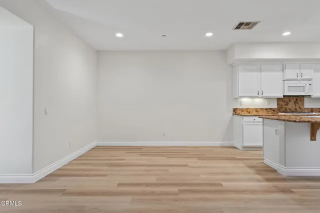 a kitchen that has a sink and a stove