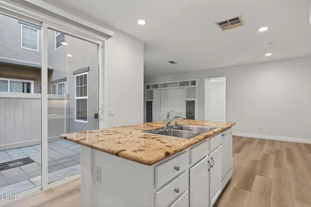 a view of an empty room with stairs