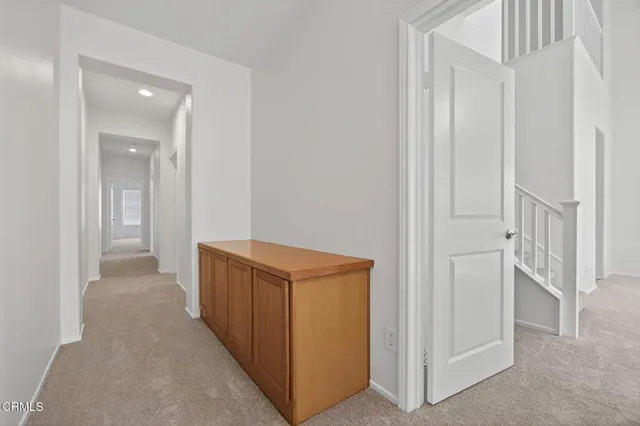 a bathroom with a granite countertop sink mirror bathtub and double