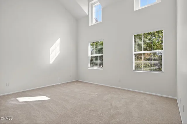 a bathroom with a granite countertop sink a mirror a bathtub and shower