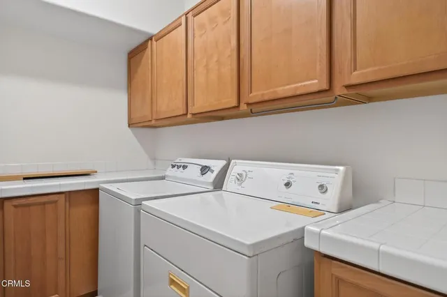 a view of a grassy field with trees