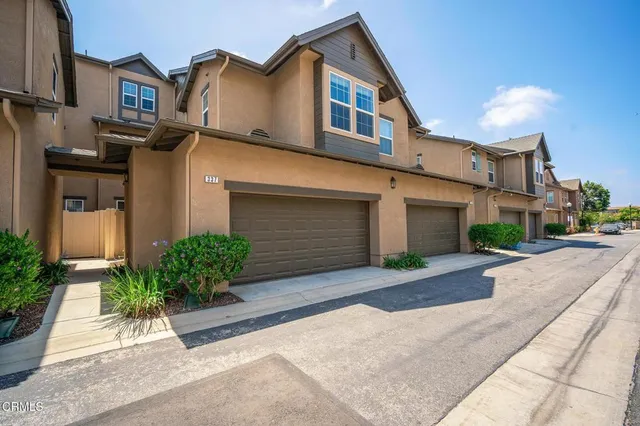 a view of swimming pool with outdoor seating and city view