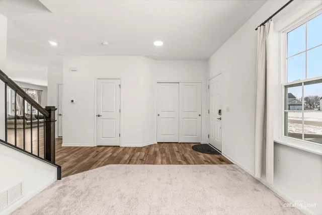 a room with furniture and a potted plant