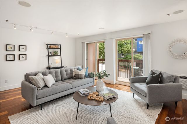 a living room with furniture and a large window