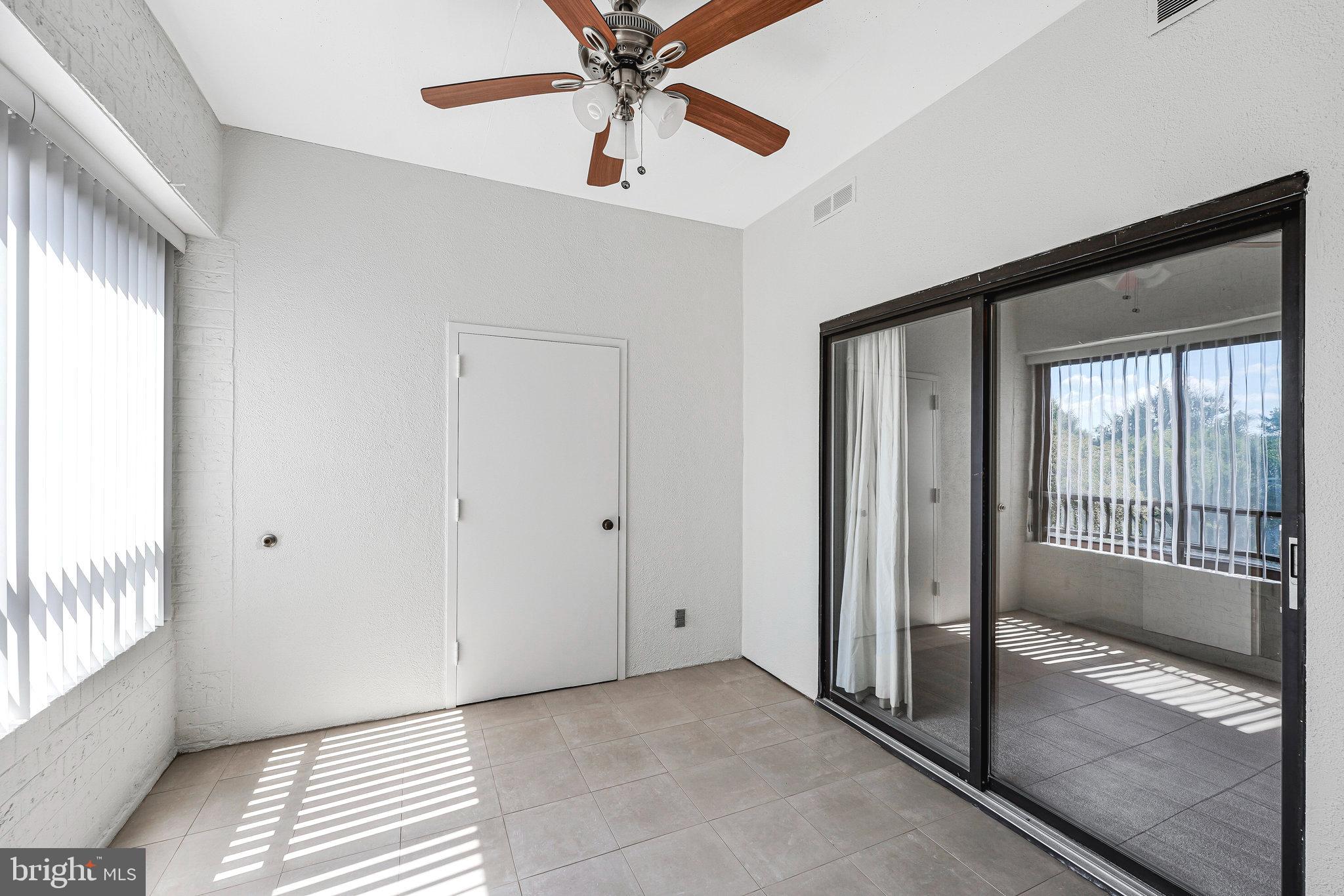 11500 Fairway Drive, Unit 402 Reston, VA 20190 - Photo 28 of 65 a view of a hallway with a chandelier