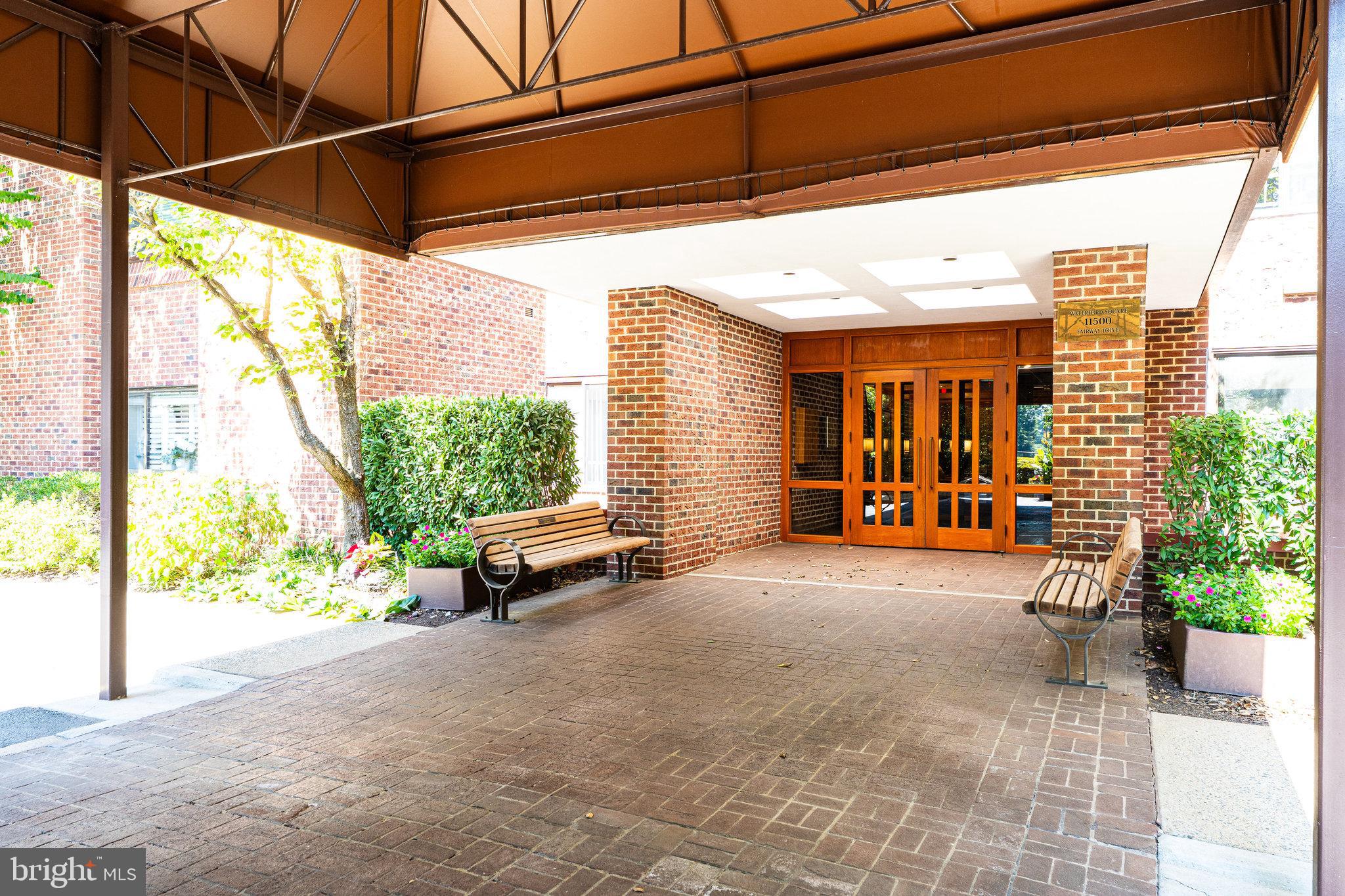 11500 Fairway Drive, Unit 402 Reston, VA 20190 - Photo 32 of 65 a view of a porch with furniture and a yard
