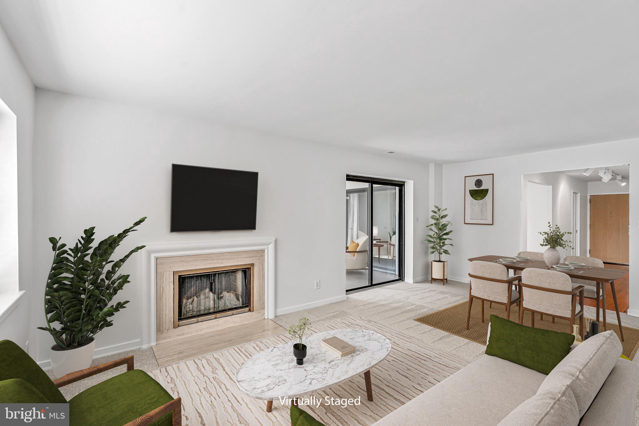 11500 Fairway Drive, Unit 402 Reston, VA 20190 - Photo 6 of 65 a living room with furniture a fireplace and a flat screen tv