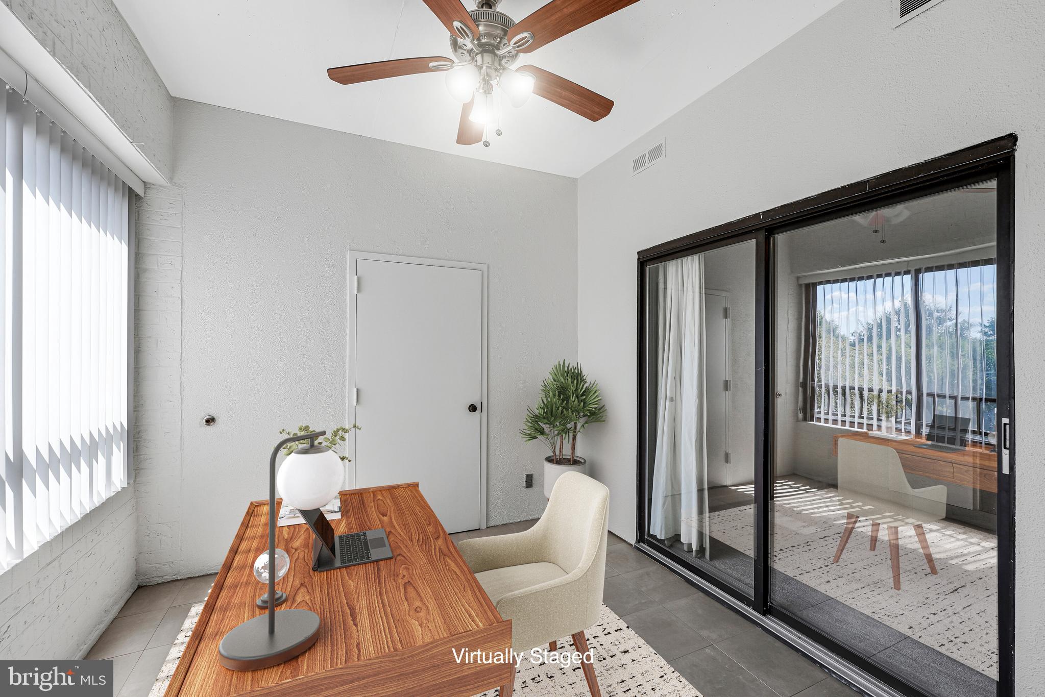 11500 Fairway Drive, Unit 402 Reston, VA 20190 - Photo 10 of 65 a living room with furniture and a large window