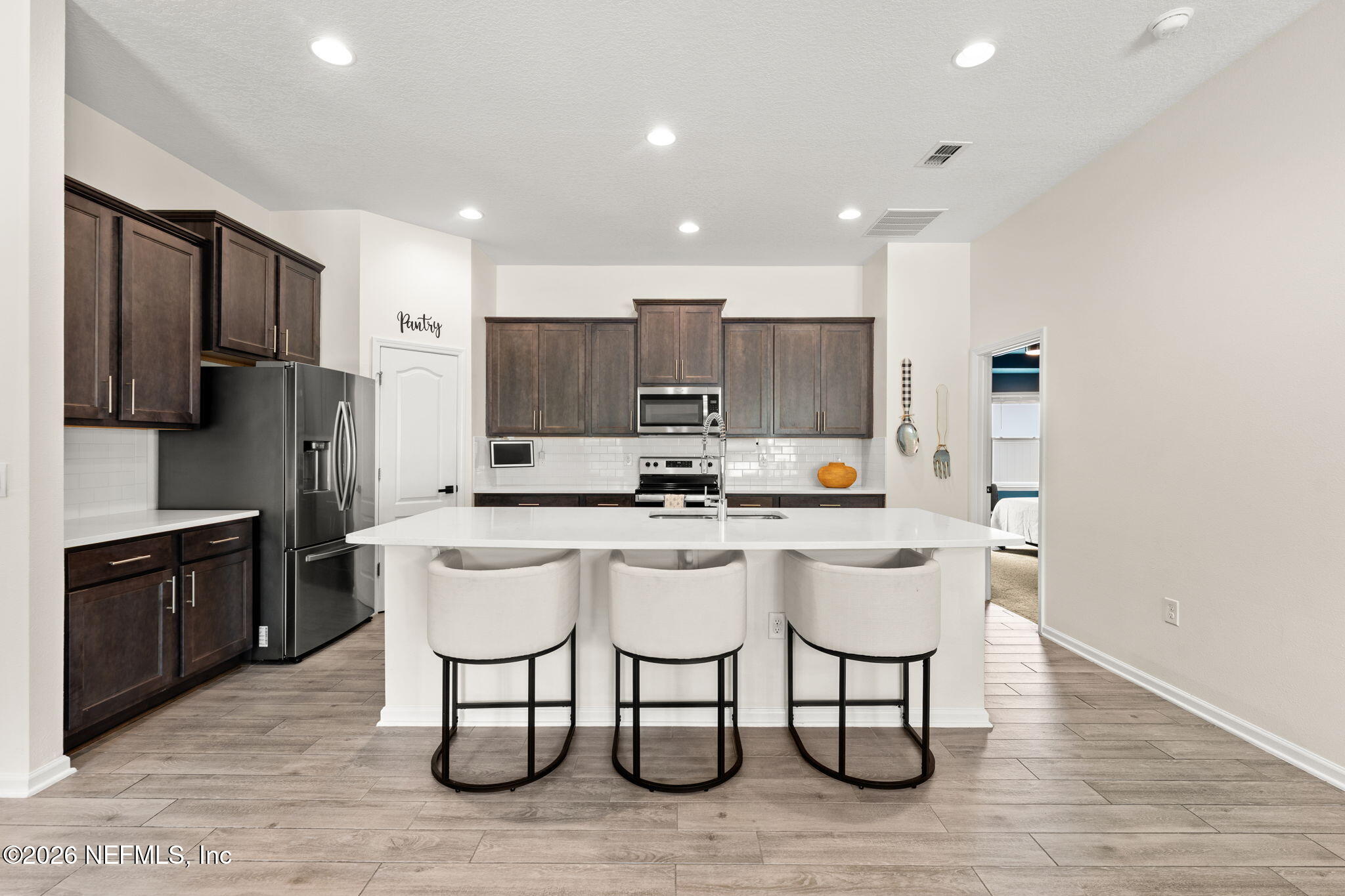 66132 Edgewater Drive Yulee, FL 32097 - Photo 3 of 25 Kitchen with Walk In Pantry