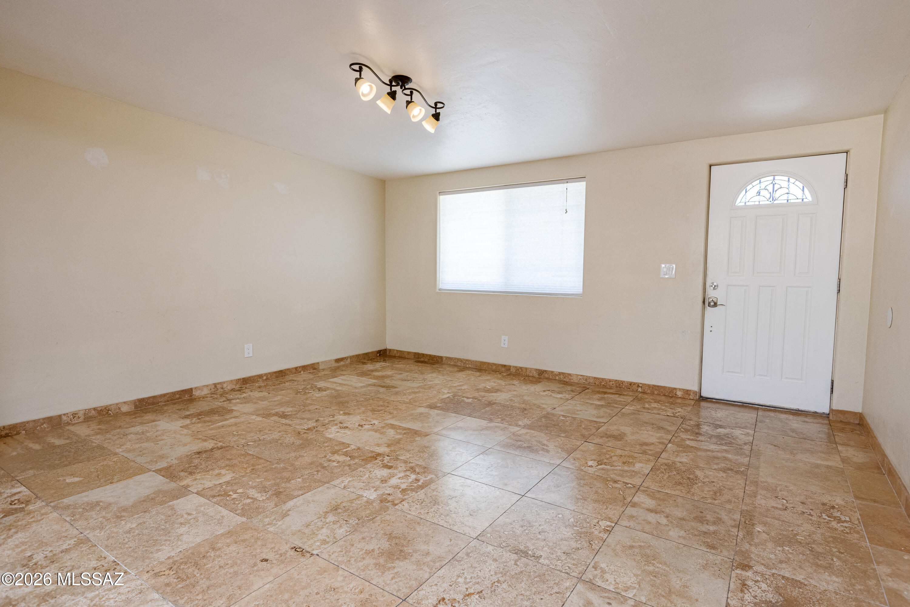 545 East Rancho Catalina Place Tucson, AZ 85704 - Photo 9 of 13 a view of an empty room with a window