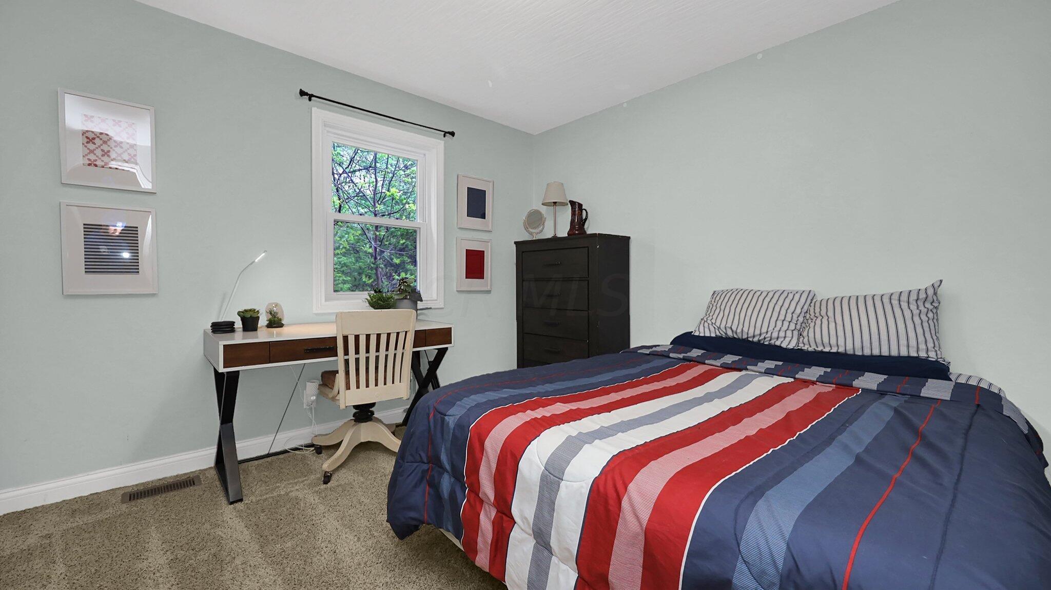 7790 Schott Road Westerville, OH 43081 - Photo 18 of 50 Bedroom #1 (located on the first floor) faces the side of the home and has room for a large bed and furniture with generous closet space boasting organizers. A great space for kids or guests!