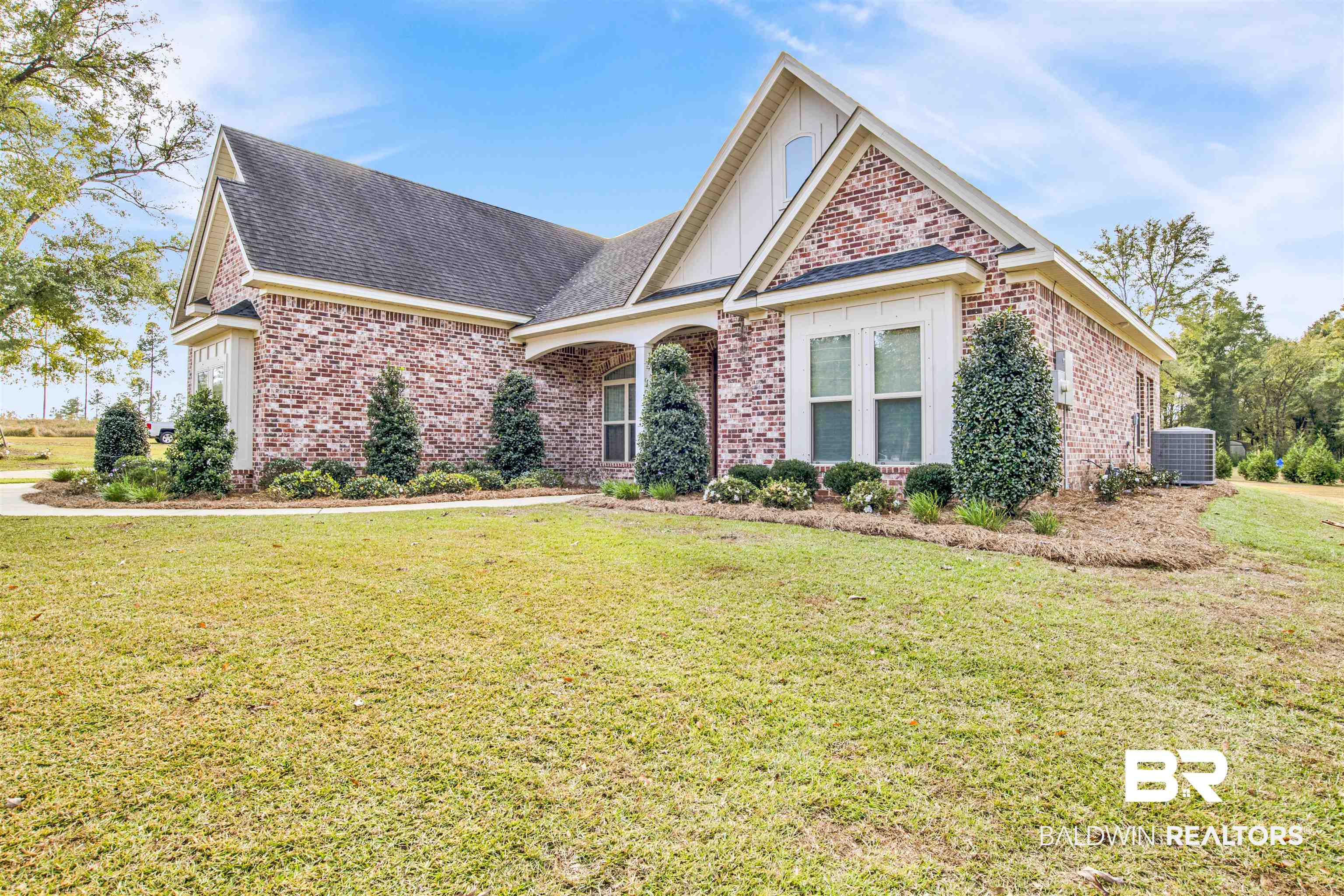 2440 Johnson Road West Mobile, AL 36695 - Photo 4 of 40 View of front property featuring a front yard and central AC