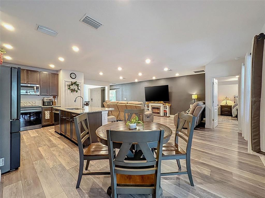 237 Leafy Way Avenue Spring Hill, FL 34606 - Photo 17 of 68 a dining room with furniture and wooden floor