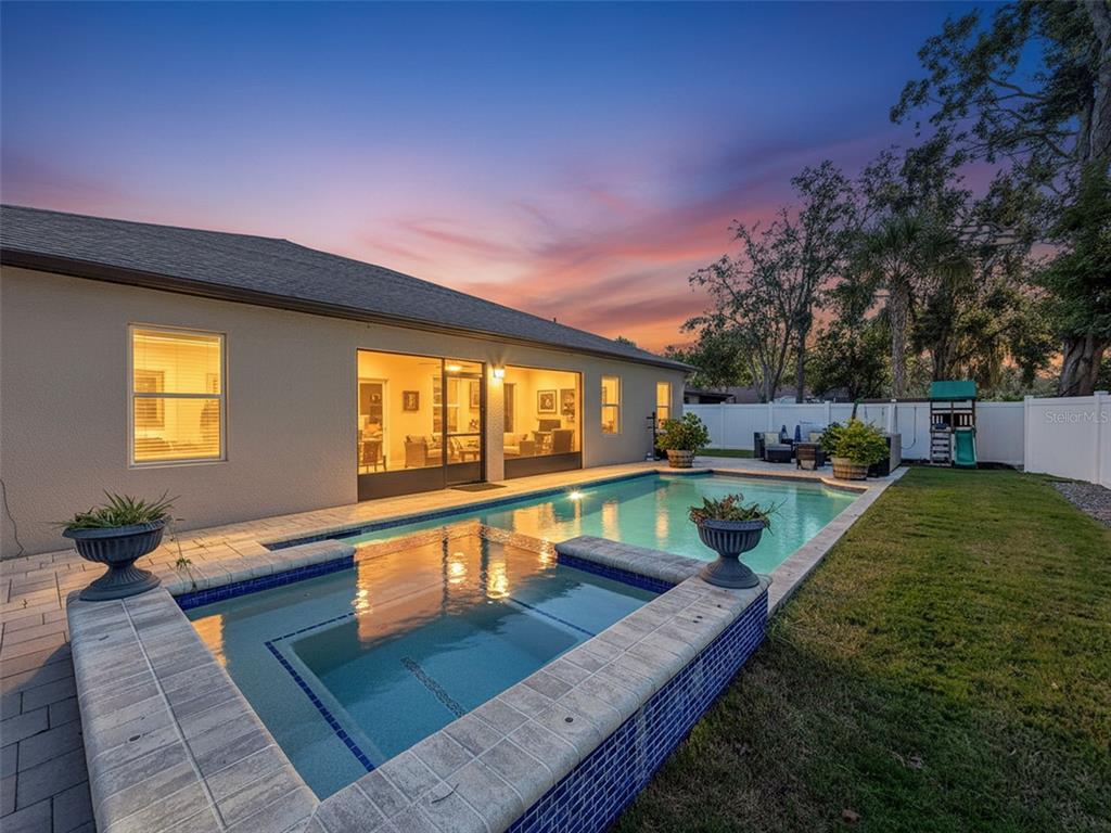 237 Leafy Way Avenue Spring Hill, FL 34606 - Photo 2 of 68 a view of a swimming pool with a patio