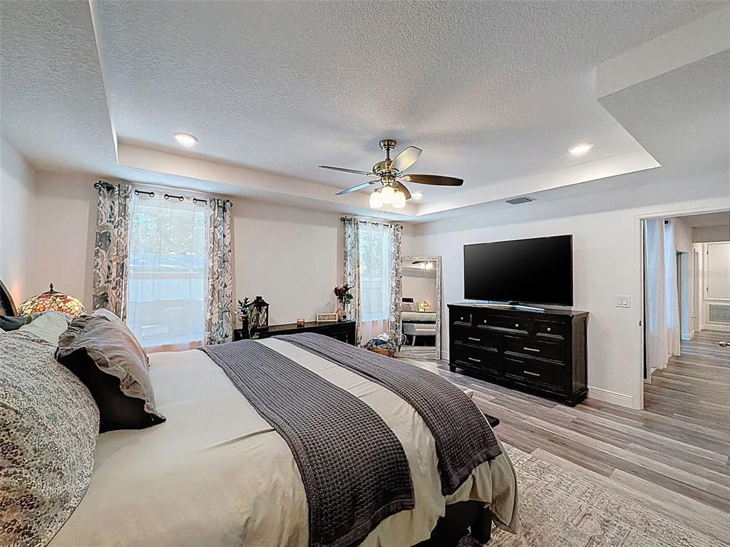 237 Leafy Way Avenue Spring Hill, FL 34606 - Photo 25 of 68 a bedroom with a bed and a flat screen tv