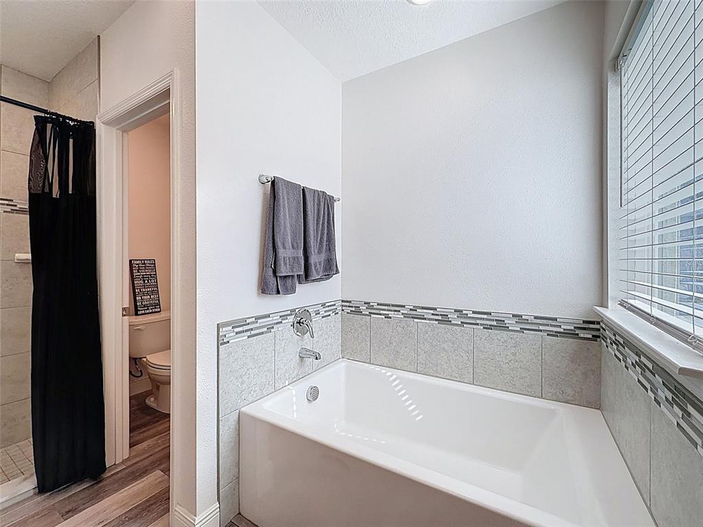 237 Leafy Way Avenue Spring Hill, FL 34606 - Photo 30 of 68 a bathroom with a bathtub and shower