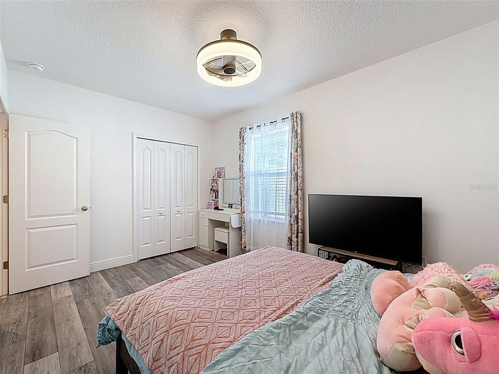 237 Leafy Way Avenue Spring Hill, FL 34606 - Photo 35 of 68 a bedroom with a bed and a flat screen tv