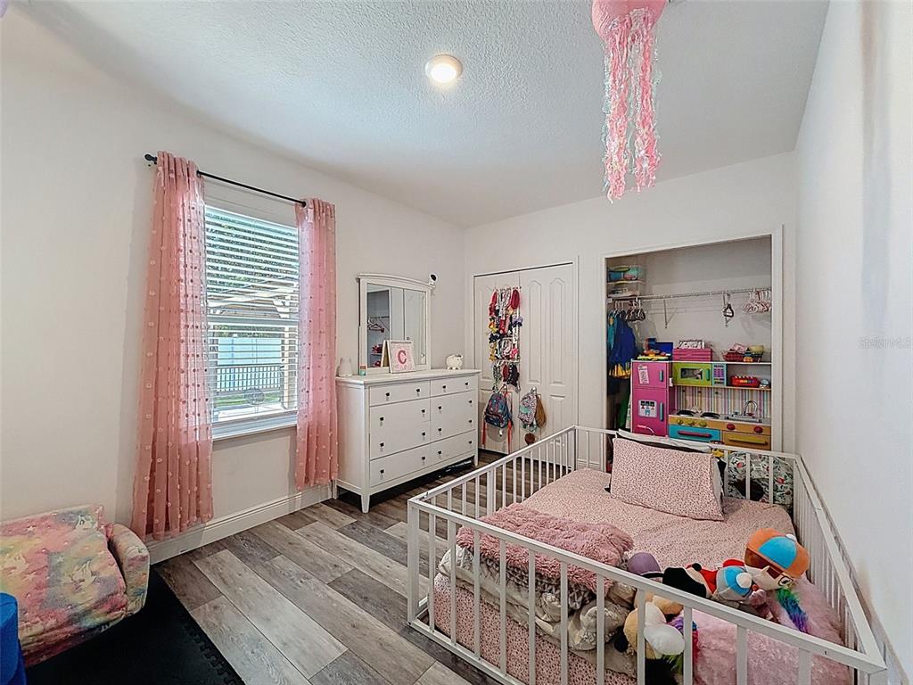 237 Leafy Way Avenue Spring Hill, FL 34606 - Photo 36 of 68 a bedroom with furniture and a window