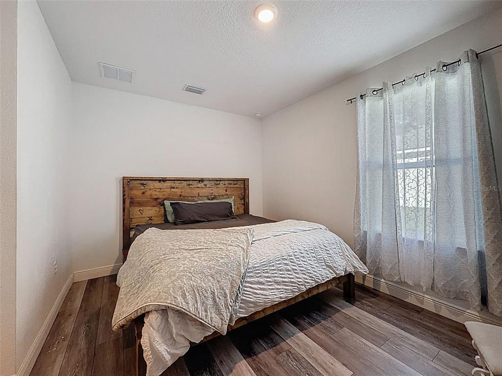 237 Leafy Way Avenue Spring Hill, FL 34606 - Photo 42 of 68 a bedroom with a bed and a window
