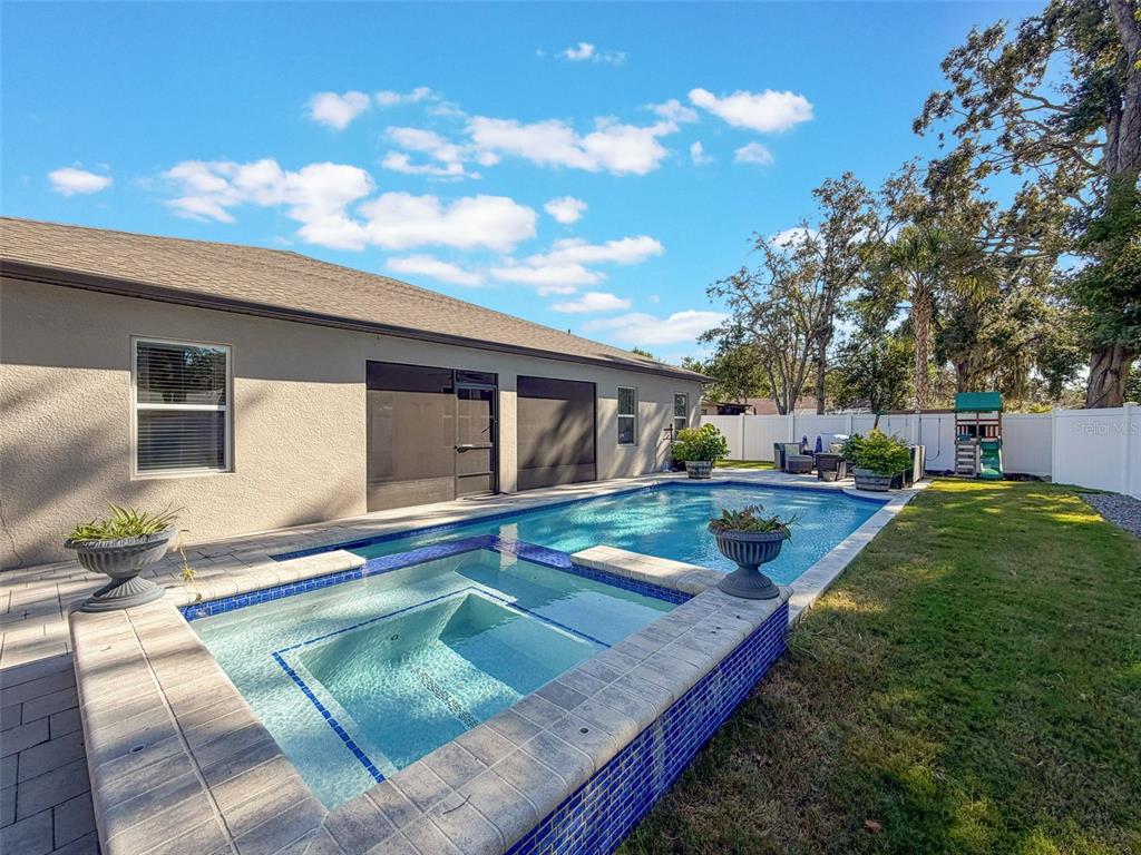237 Leafy Way Avenue Spring Hill, FL 34606 - Photo 50 of 68 a view of a house with swimming pool and a sitting area