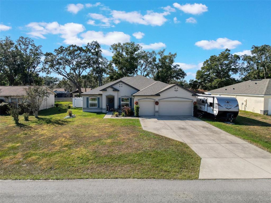 237 Leafy Way Avenue Spring Hill, FL 34606 - Photo 63 of 68 a aerial view of a house with yard