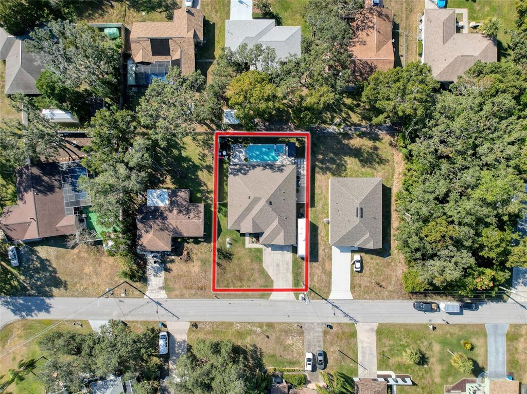 237 Leafy Way Avenue Spring Hill, FL 34606 - Photo 66 of 68 an aerial view of residential houses with outdoor space and parking