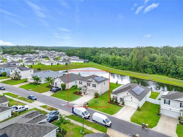 a view of yard with lots of trees