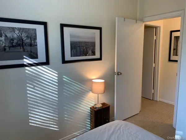 a view of a hallway with paintings on the wall